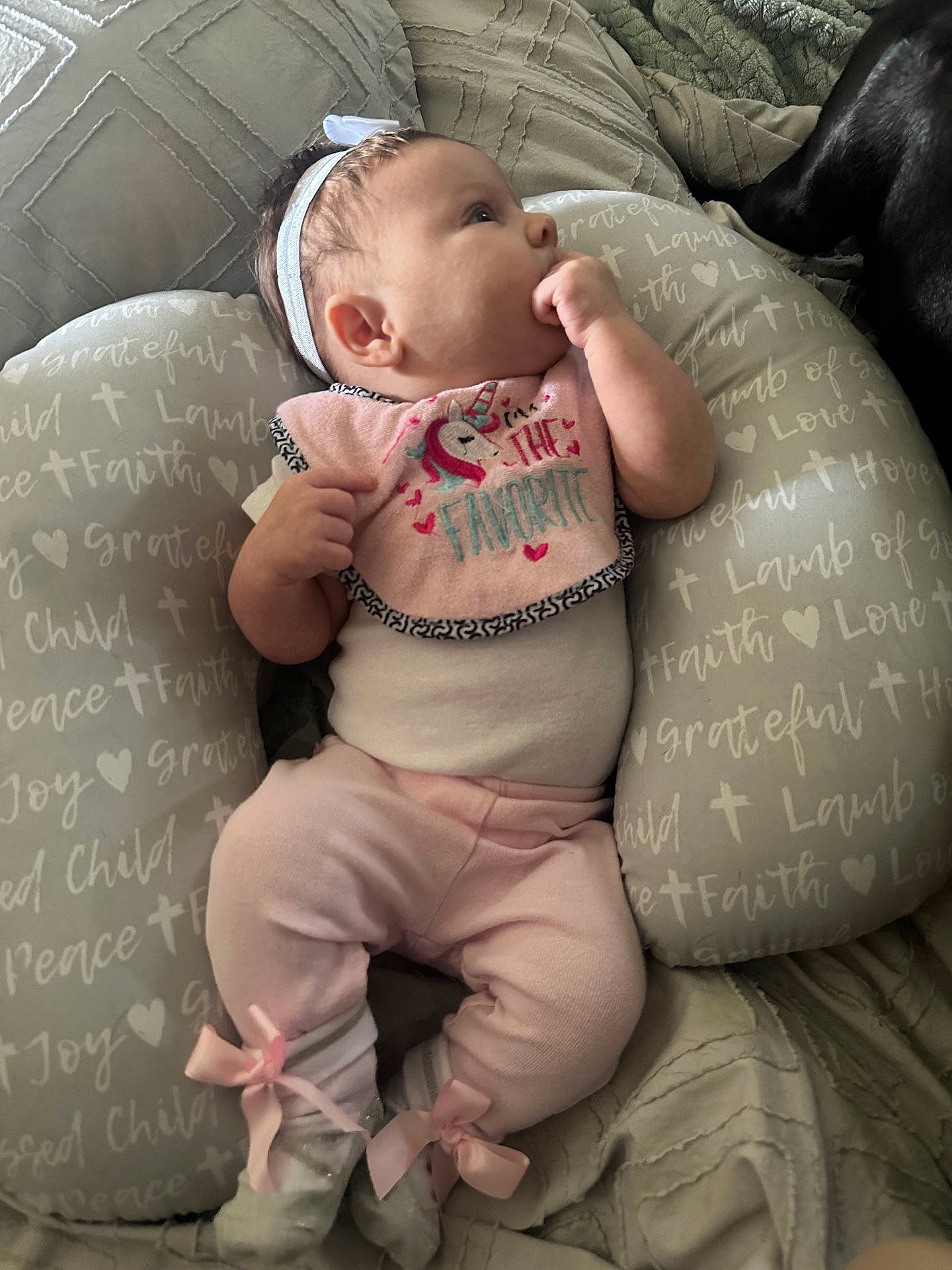 Meadow is registered to the contest to win money with this photo: baby, bib, child, comfortable, cozy, cute, hand, headband, indoor, infant, lying_down, patterned_pillow, pillow, pink_clothing, quilt, ribbons, sleepwear, soft_lighting, sucking_thumb, unicorn