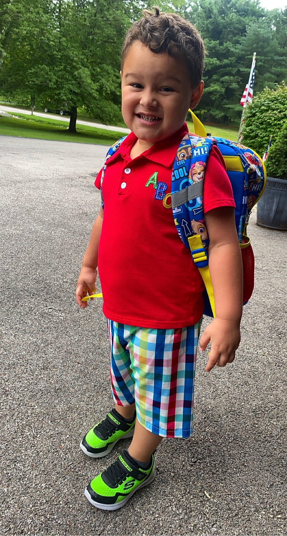 Noah is registered to the contest to win money with this photo: baby_toddler_clothing, child, cool, electric_blue, face, fun, grass, green, happy, joy, leisure, pattern, person, plaid, plant, recreation, sleeve, smile, t_shirt, toddler