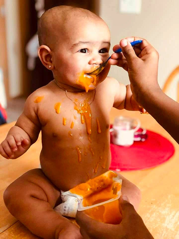 Jamir is registered to the contest to win money with this photo: abdomen, arm, chest, child, facial_expression, finger, food_craving, fun, hand, happy, joint, mouth, muscle, nail, neck, nose, orange, person, tableware, thigh