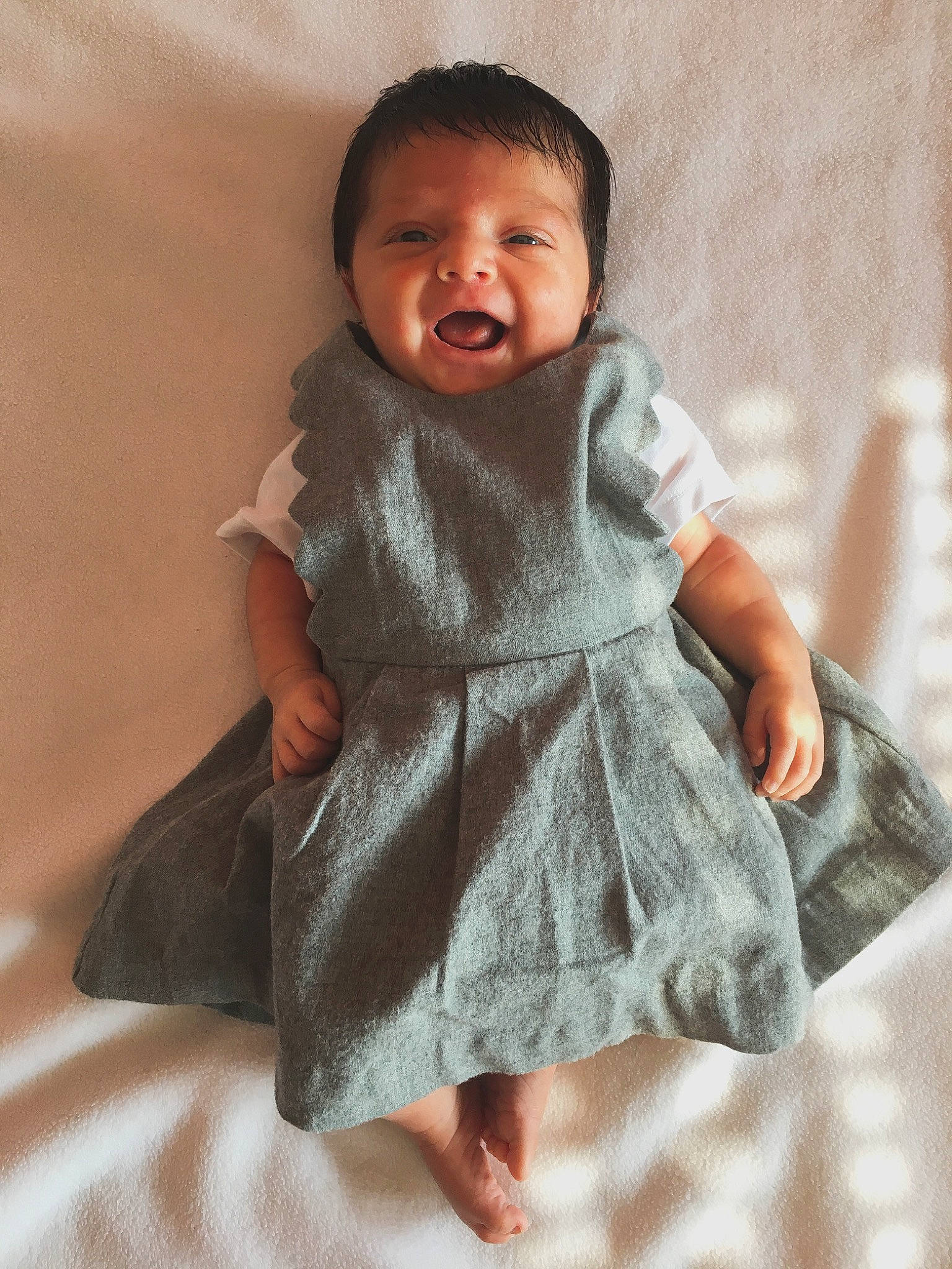 Aaliyah participe au concours pour gagner de l'argent avec cette photo : baby, child, dress, pattern, person, skin, smile, textile, toddler