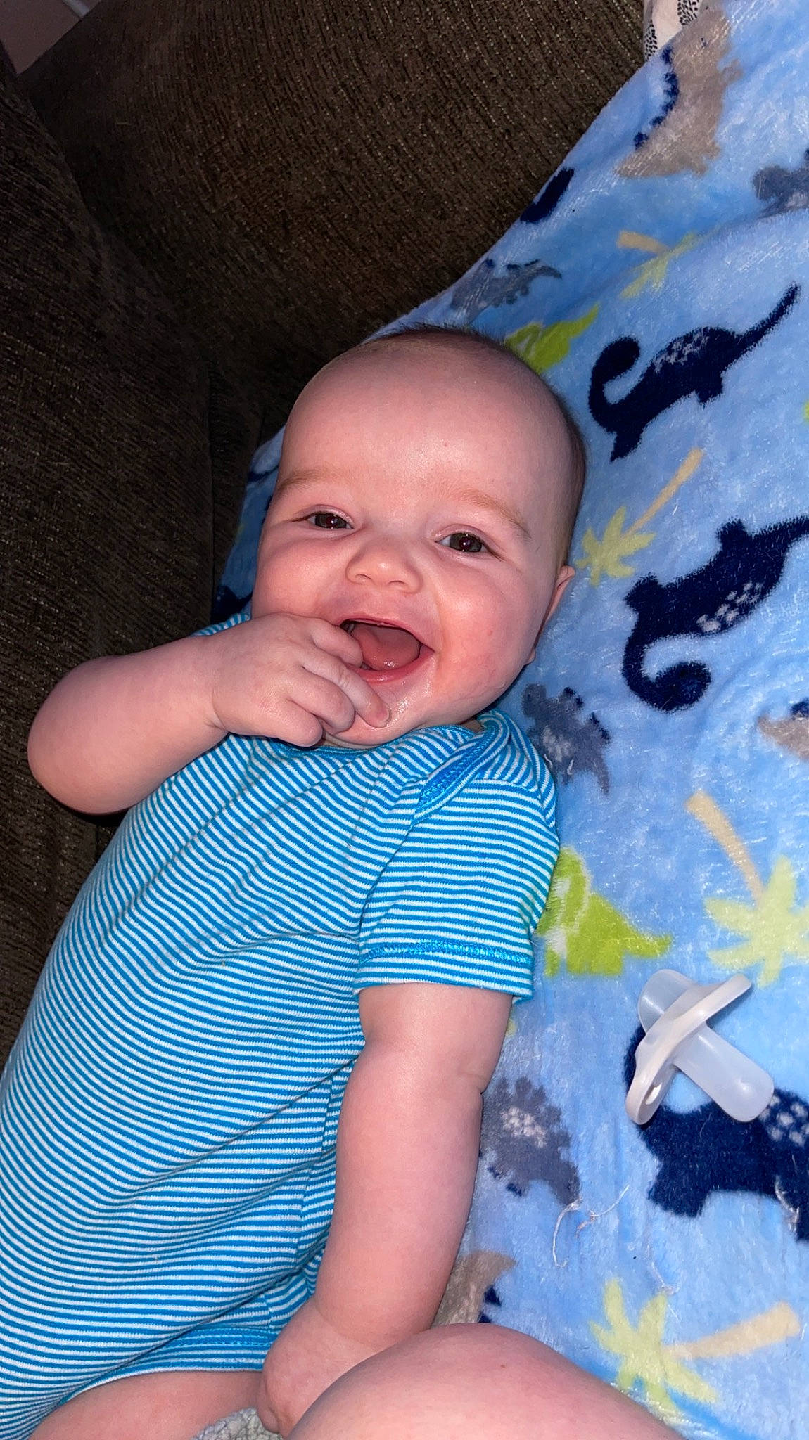 Cayson is registered to the contest to win money with this photo: azure, baby, baby_toddler_clothing, cheek, comfort, finger, gesture, hand, happy, human_body, iris, lip, mouth, nose, person, purple, skin, sleeve, smile, textile