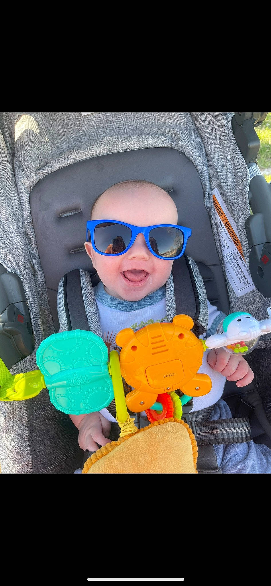 Cayson is registered to the contest to win money with this photo: baby, baby_products, baby_toddler_clothing, car_seat, child, cool, electric_blue, eyewear, fun, glasses, goggles, happy, mouth, person, personal_protective_equipment, play, stuffed_toy, sunglasses, toddler, toy