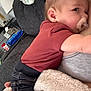 Bryson joined the competition — help win amazing prizes! adult, baby, blanket, casual, clothing, comfort, couch, cozy, face, hand, head, home, indoor, infant, jeans, pacifier, person, red_shirt, relaxation, snuggling