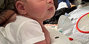 Bryson is registered to the contest to win money with this photo: animal, baby, blanket, carpet, child, clothing, curtain, cute, dog, face, furniture, hand, indoor, person, pet, pillow, room, soft, toddler, toy