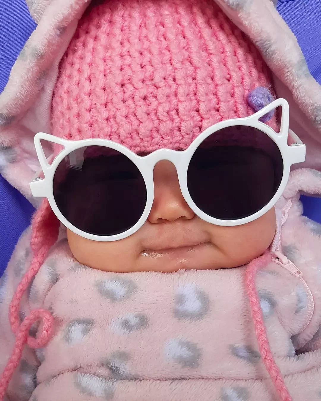 Miranda is registered to the contest to win money with this photo: baby_toddler_clothing, chin, eye, eye_glass_accessory, eyebrow, eyelash, eyewear, face, glasses, goggles, head, headgear, lip, mouth, nose, person, pink, sleeve, sunglasses, textile