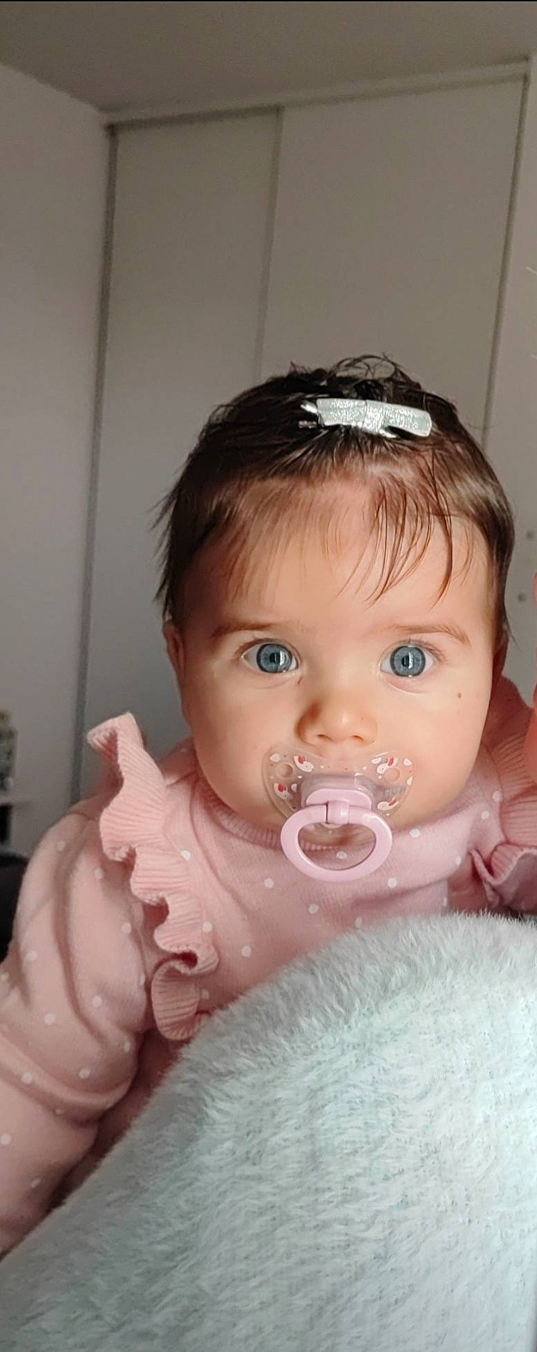 Lola participe au concours pour gagner de l'argent avec cette photo : baby, baby_toddler_clothing, bathing, cheek, child, chin, dress, drinkware, eyebrow, eyelash, fashion_accessory, hair_accessory, headgear, headpiece, iris, lip, nose, person, skin, sweetness