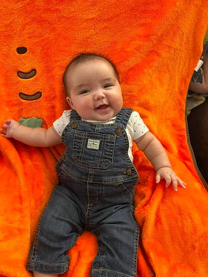 Avery joined the competition — help win amazing prizes! baby, baby_toddler_clothing, cheek, chin, comfort, eye, facial_expression, finger, happy, head, human, human_body, joy, leaf, nose, orange, person, product, skin, sleeve