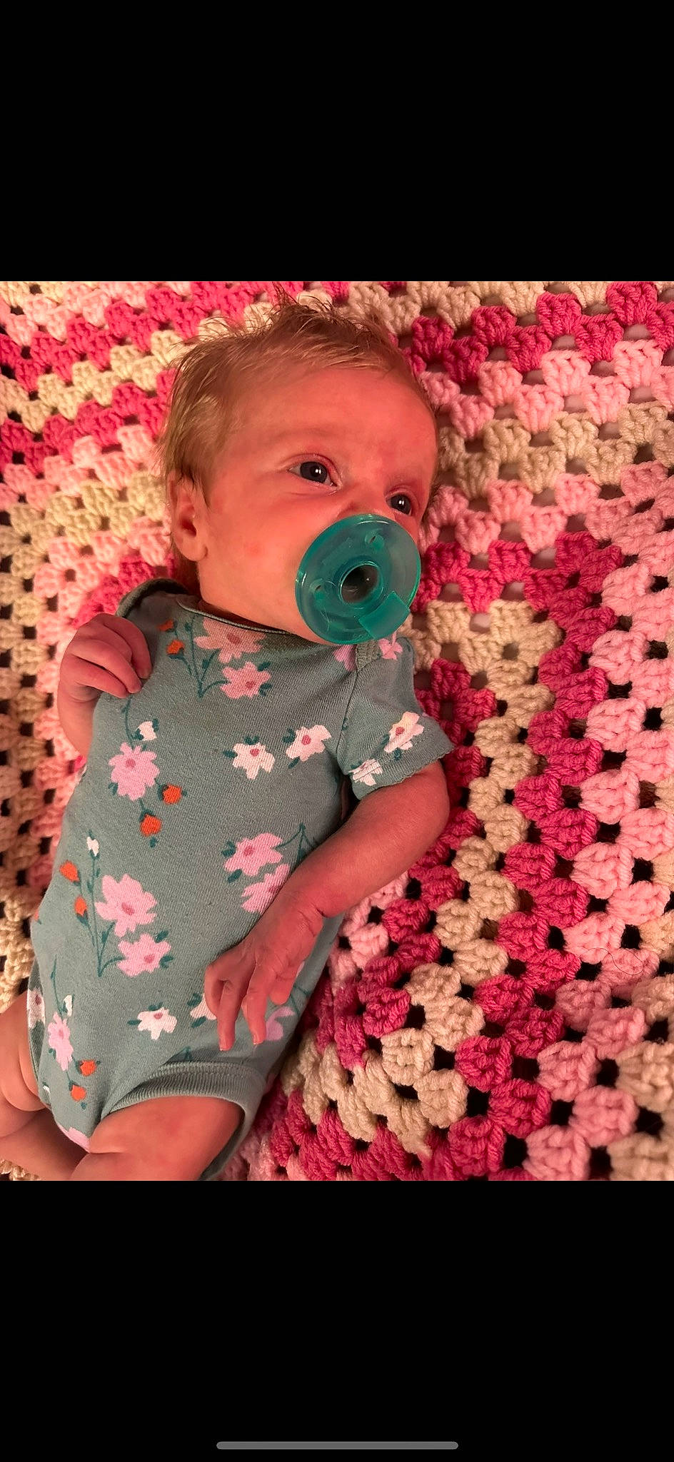 Ember is registered to the contest to win money with this photo: arm, baby, baby_safety, baby_toddler_clothing, cheek, comfort, design, eye, face, happy, head, magenta, mouth, nose, pattern, person, pink, skin, sleeve, textile