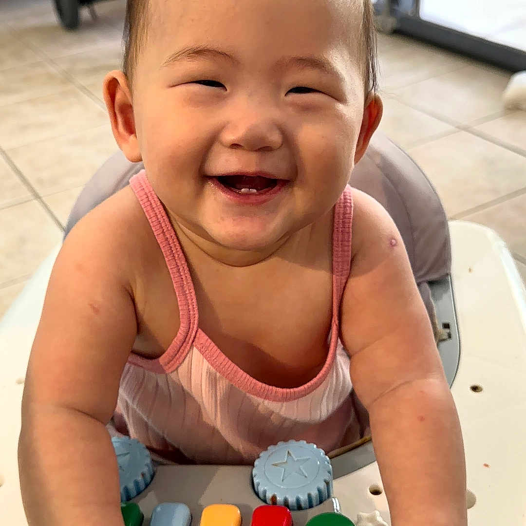 Ahrin joined the competition — help win amazing prizes! baby, smiling, toy, walker, indoor, child, happy, colorful, piano, floor, window, stroller, hands, face, person, cute, infant, play, joy, tiled_floor