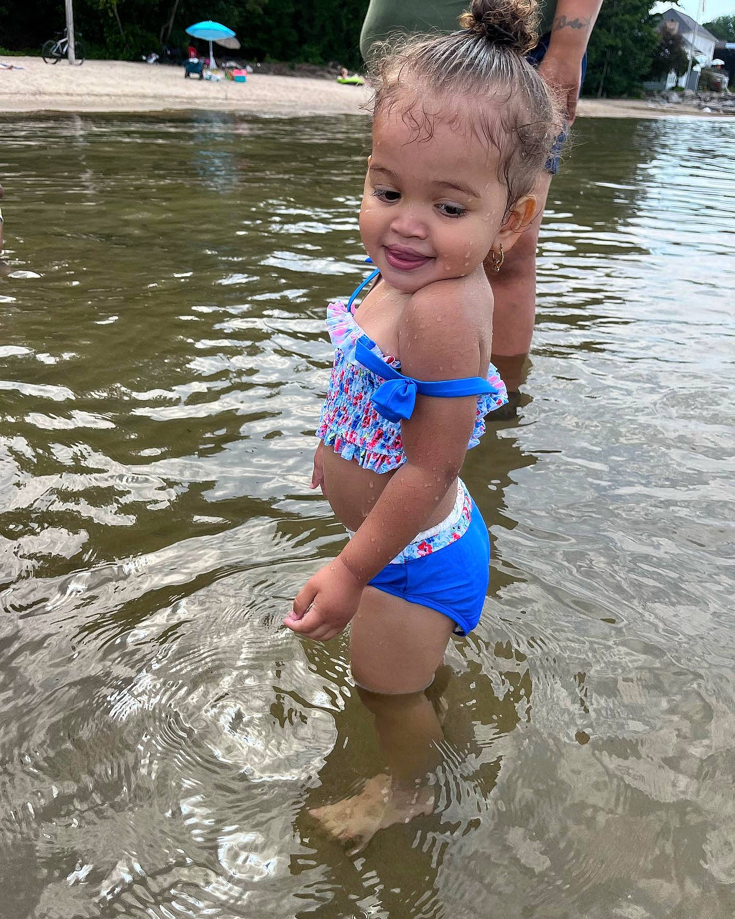 Delaney is registered to the contest to win money with this photo: bathing, chest, child, electric_blue, fun, hair, head, human_body, joy, lake, leg, leisure, one_piece_swimsuit, person, recreation, summer, swimwear, thigh, toddler, undergarment
