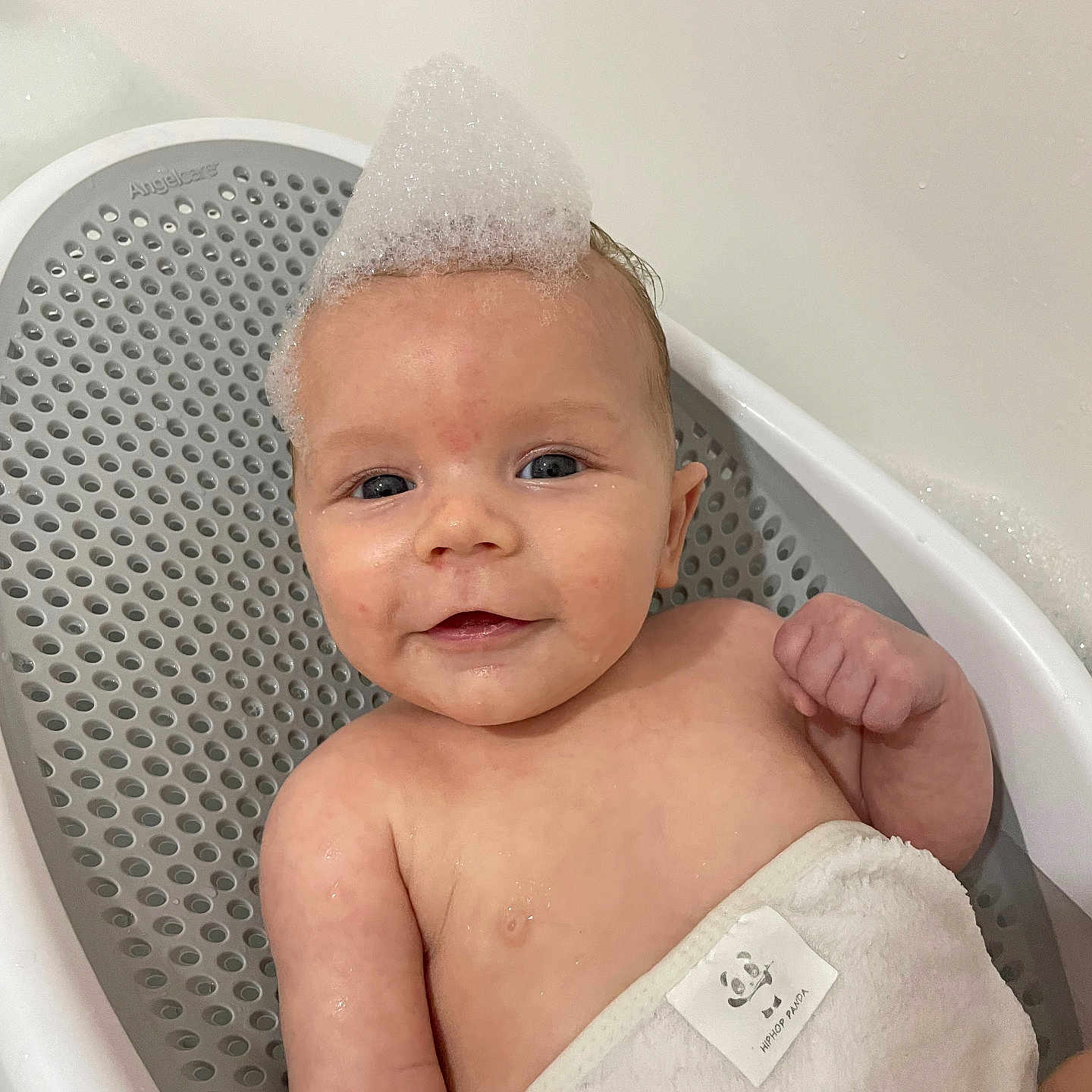 River is registered to the contest to win money with this photo: baby, bathing, bathroom, bathtub, diaper, face, happy, head, indoors, newborn, person, photography, portrait, room, shower, smile, tub, washing