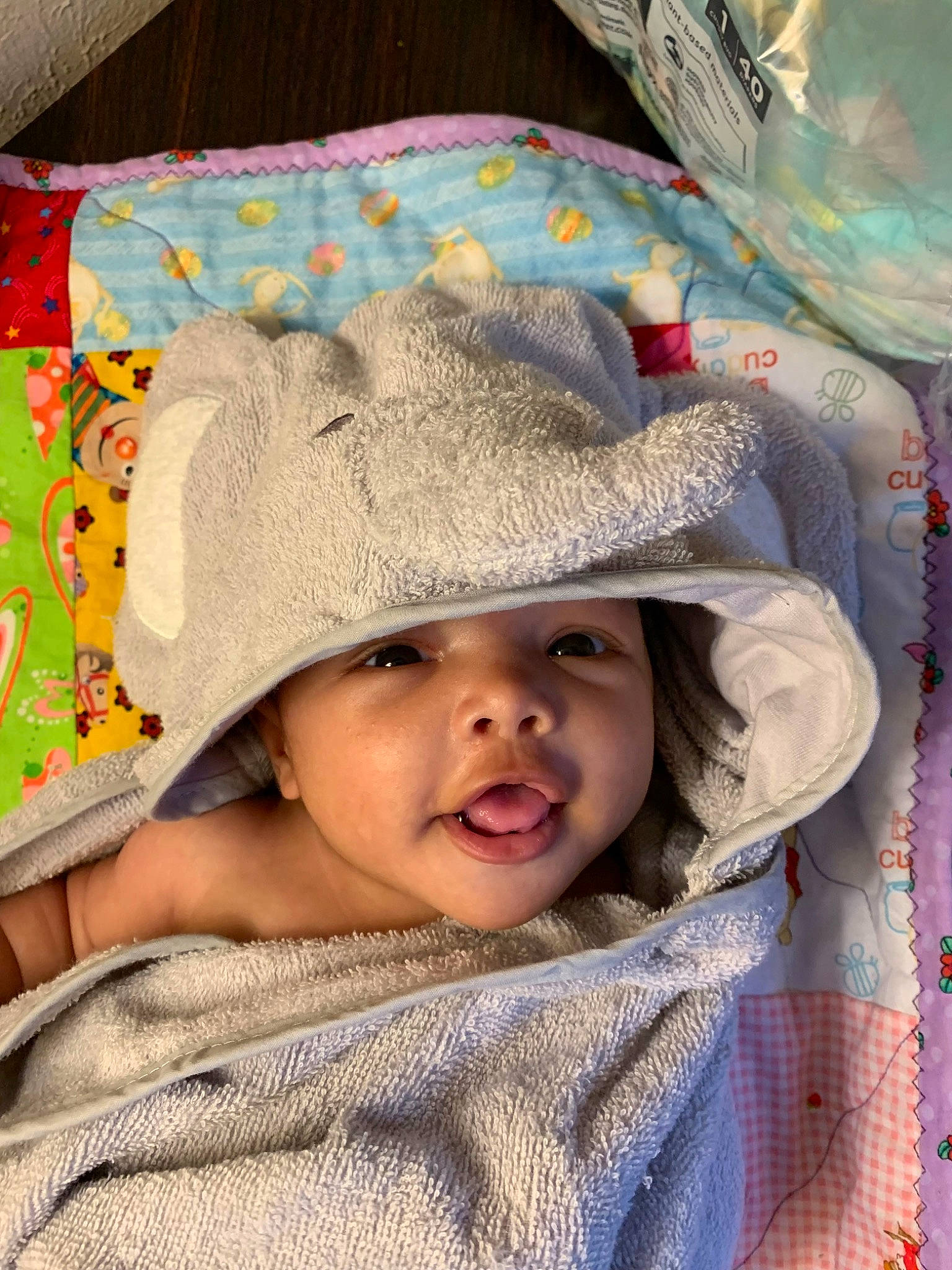 Avah is registered to the contest to win money with this photo: baby, bonnet, cap, child, comfort, fashion_accessory, fun, happy, hat, headgear, headwear, linens, pattern, person, portrait_photography, sleeve, smile, sun_hat, textile, toddler