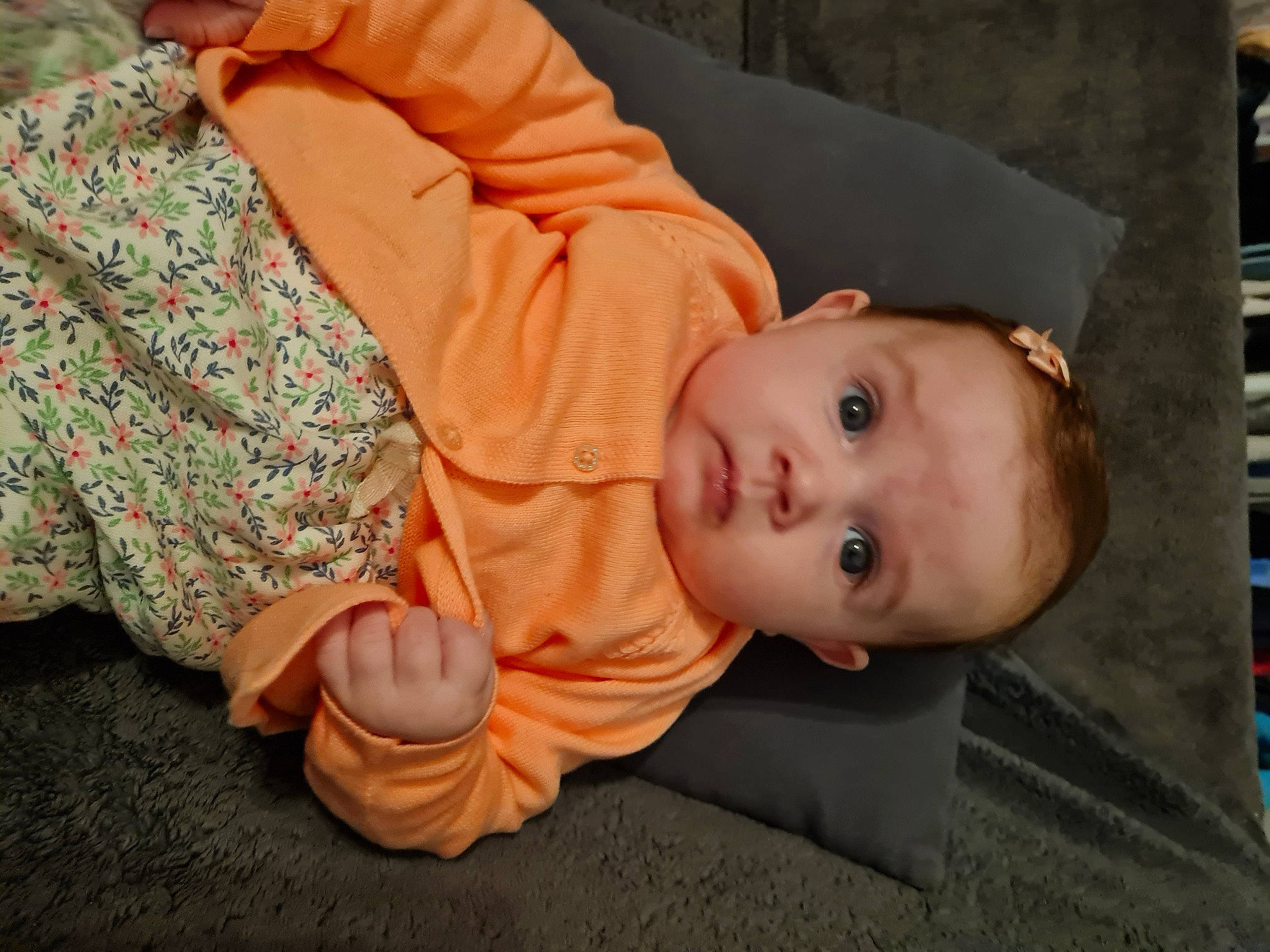 Kayliah participe au concours pour gagner de l'argent avec cette photo : baby, baby_toddler_clothing, chair, cheek, child, chin, comfort, flooring, fun, gesture, mouth, nose, peach, person, sitting, skin, sleeve, thumb, toddler, tree