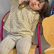 Lucia a rejoint le concours — aidez-le/la à gagner de superbes lots ! child, girl, sitting, chair, pink_chair, yellow_chair, knitted_sweater, ribbed_pants, white_boots, peace_sign, pouty_face, indoor, wall, playful, casual_clothing, long_hair, light_background, furniture, pose, person