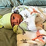 Grayson joined the competition — help win amazing prizes! newborn, baby, blanket, hat, striped_hat, bed, soft, cozy, cute, lying_down, infant, wrapped, sleepwear, face, person, indoors, comfort, resting, young_child, warm