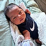 Grayson is registered to the contest to win money with this photo: newborn, baby, blanket, mittens, onesie, face, sleeping, bed, bedding, resting, soft, cozy, infant, clothing, person, indoor, cute, young, portrait, relaxing