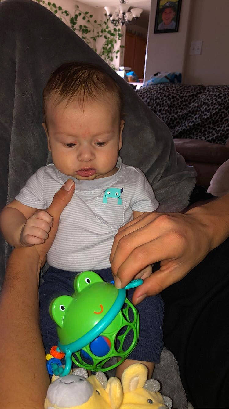 Ermias joined the competition — help win amazing prizes! baby, child, eye, iris, person, play, smile, toddler, toy, under_exposed