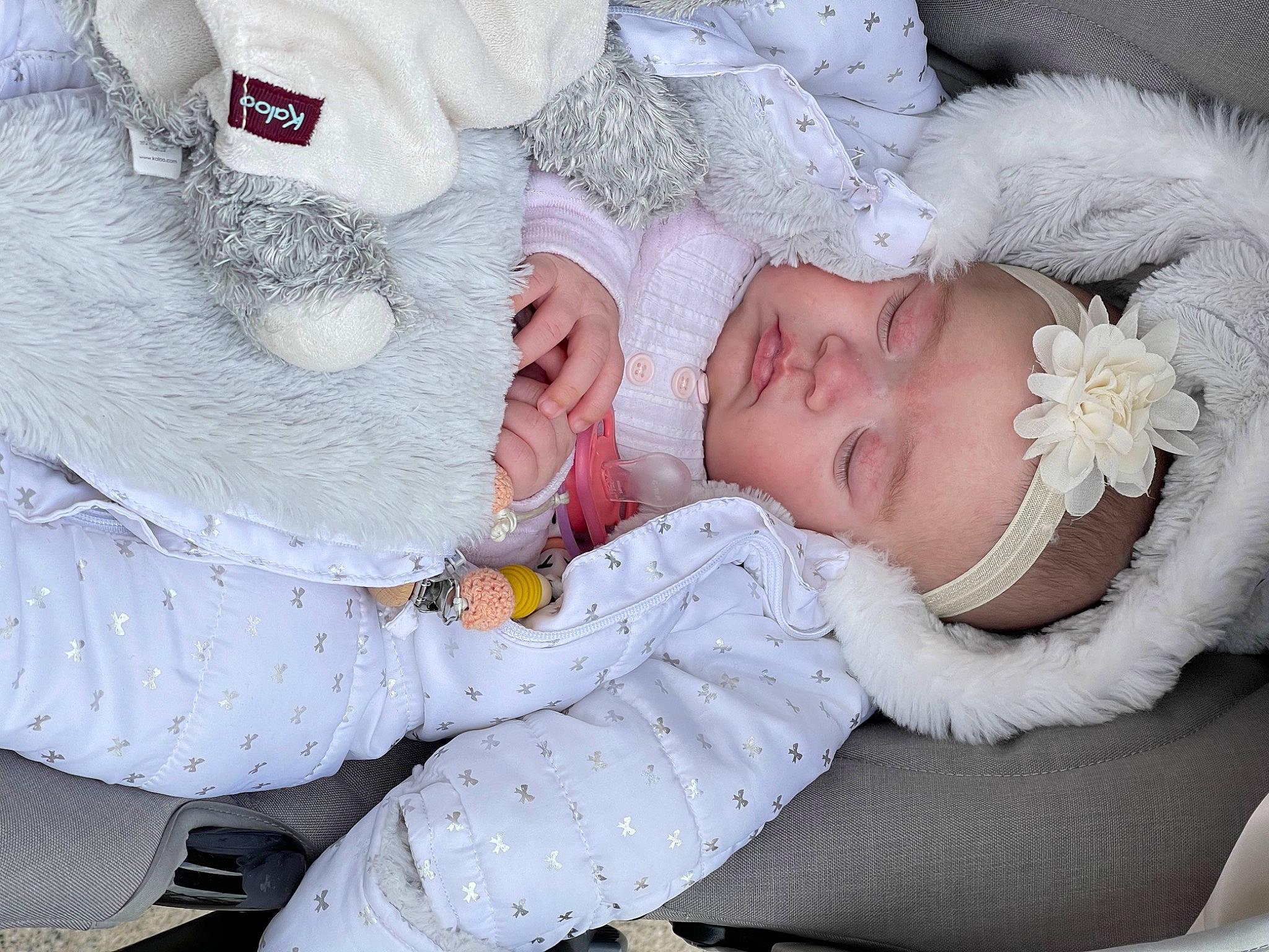 Safiya participe au concours pour gagner de l'argent avec cette photo : arm, baby, baby_products, baby_sleeping, baby_toddler_clothing, child, comfort, eyelash, fashion_accessory, finger, gesture, hand, headgear, headwear, iris, knit_cap, pattern, person, skin, sleeve