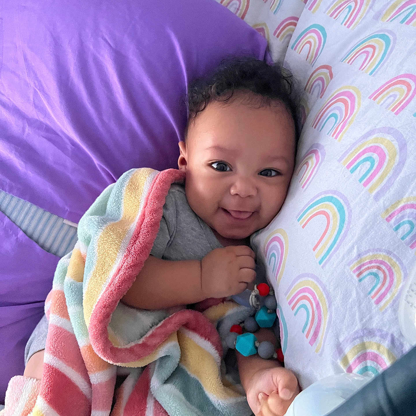 Rashawn is registered to the contest to win money with this photo: baby, bed, bedroom, blanket, couch, crib, cushion, face, furniture, happy, head, homedecor, indoors, infantbed, person, photography, portrait, quilt, room, smile