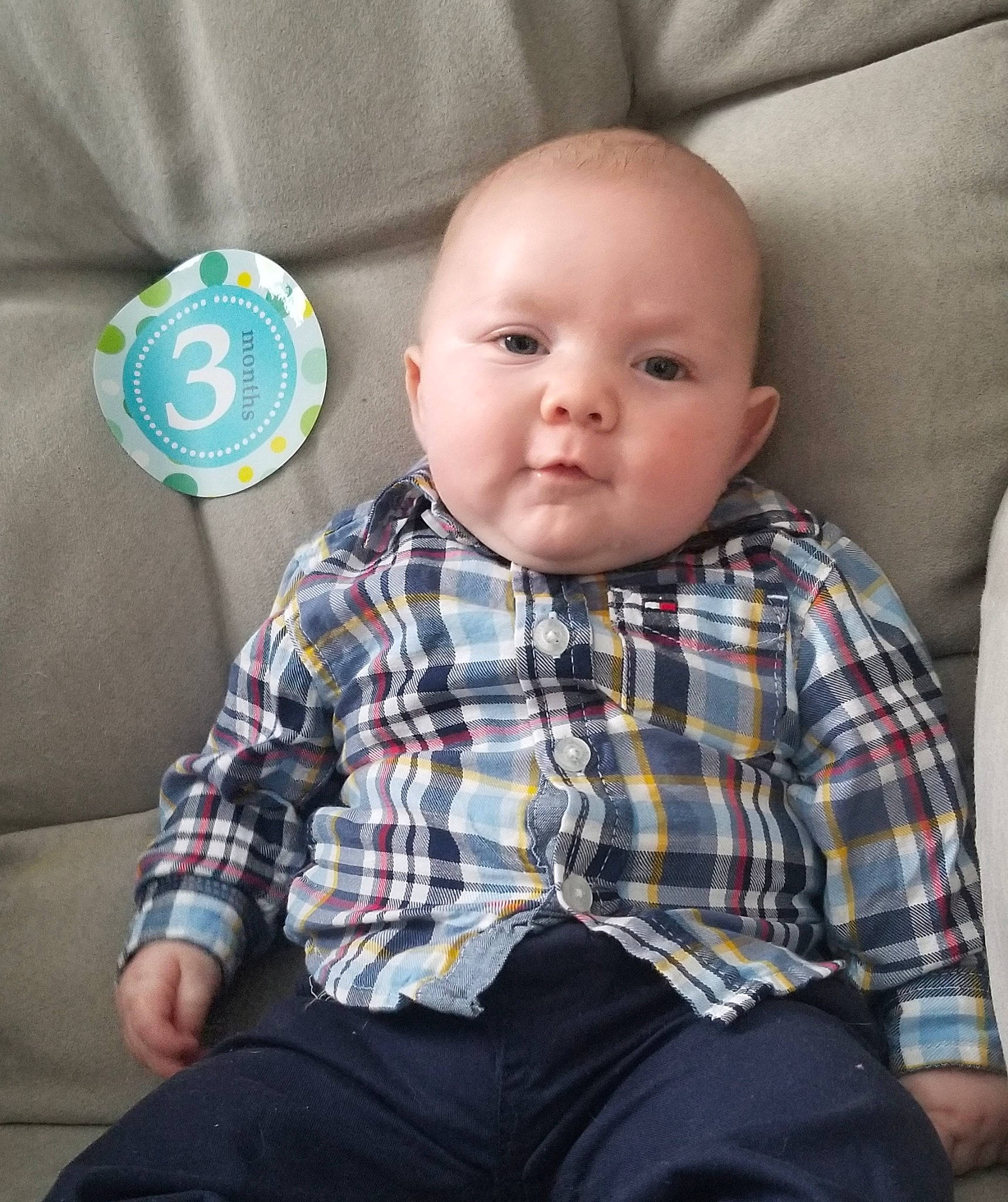 Konner is registered to the contest to win money with this photo: baby, baby_products, baby_toddler_clothing, child, design, pattern, person, plaid, sitting, toddler