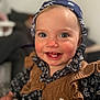 Victoire a rejoint le concours — aidez-le/la à gagner de superbes lots ! baby, bandana, blue_eyes, brown_vest, child, closeup, clothing, cute, cute_outfit, expression, face, floral_shirt, happy, indoors, knitwear, person, portrait, smiling, toddler, young_child