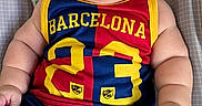Hansel joined the competition — help win amazing prizes! baby, infant, child, smiling, portrait, football_jersey, barcelona, sportswear, red, blue, yellow, play_mat, rainbow, animal_design, monkey, lying_down, indoors, happy, face, bare_feet