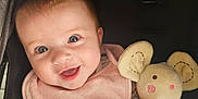 Brooklyn joined the competition — help win amazing prizes! baby, smiling, blue_eyes, pink_bib, plush_toy, mouse_toy, stroller, child, happy, cute, infant, soft_texture, hand, face, head, clothing, comfort, portrait, toy, cozy