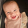 Brooklyn is registered to the contest to win money with this photo: baby, smiling, face, closeup, infant, pink_bib, cute, happy, child, clothing, portrait, young, adorable, expression, person, sitting, fun, joy, indoor, soft_lighting