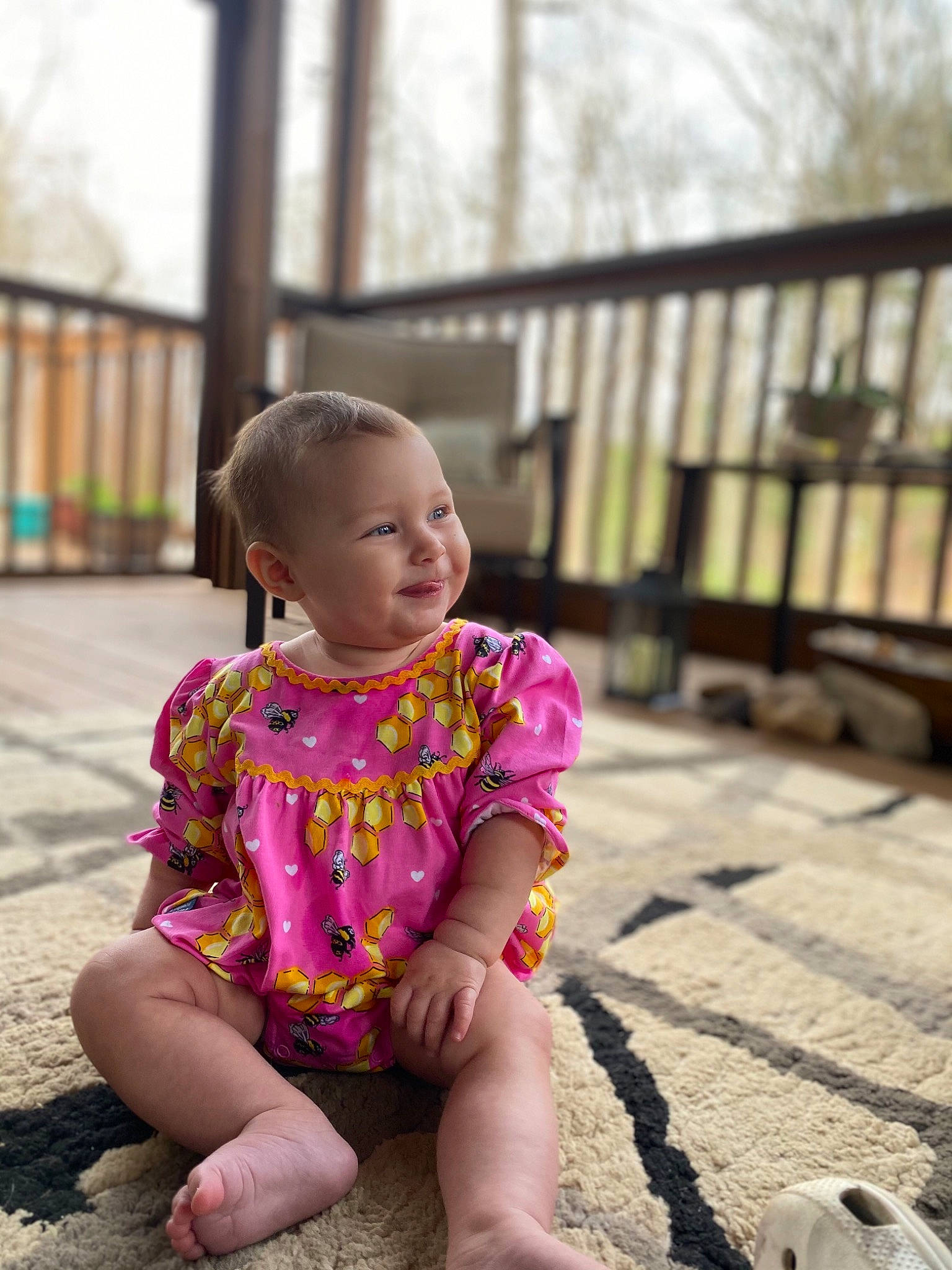 Stella is registered to the contest to win money with this photo: baby, baby_toddler_clothing, chin, dress, eye, face, fun, grass, happy, human_leg, leisure, magenta, person, pink, sitting, skin, sleeve, smile, t_shirt, thigh