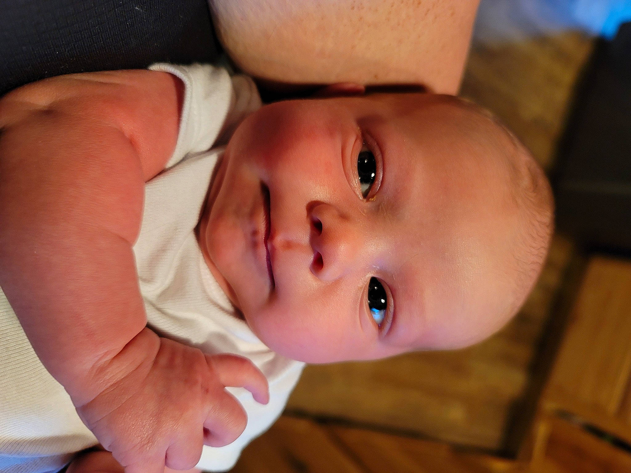 Dustin is registered to the contest to win money with this photo: arm, baby, baby_toddler_clothing, cheek, dress, eye, eyelash, finger, hand, happy, head, human_body, iris, lip, mouth, nose, person, skin, sleeve, smile