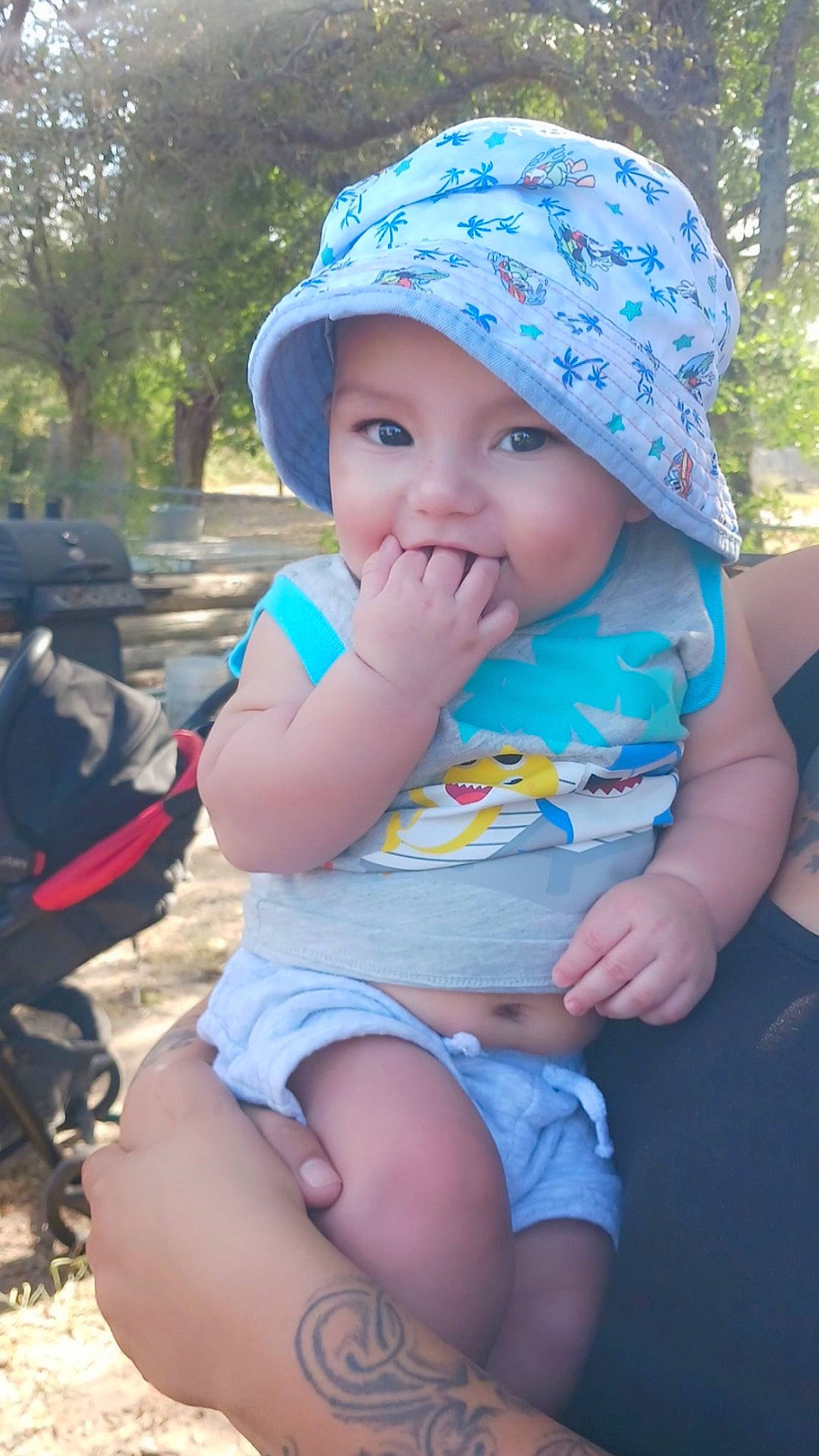 Dominic joined the competition — help win amazing prizes! baby, baby_toddler_clothing, baseball_cap, blue, cap, cool, fun, grass, happy, headgear, headwear, leaf, leisure, person, photograph, pink, plant, product, skin, thigh