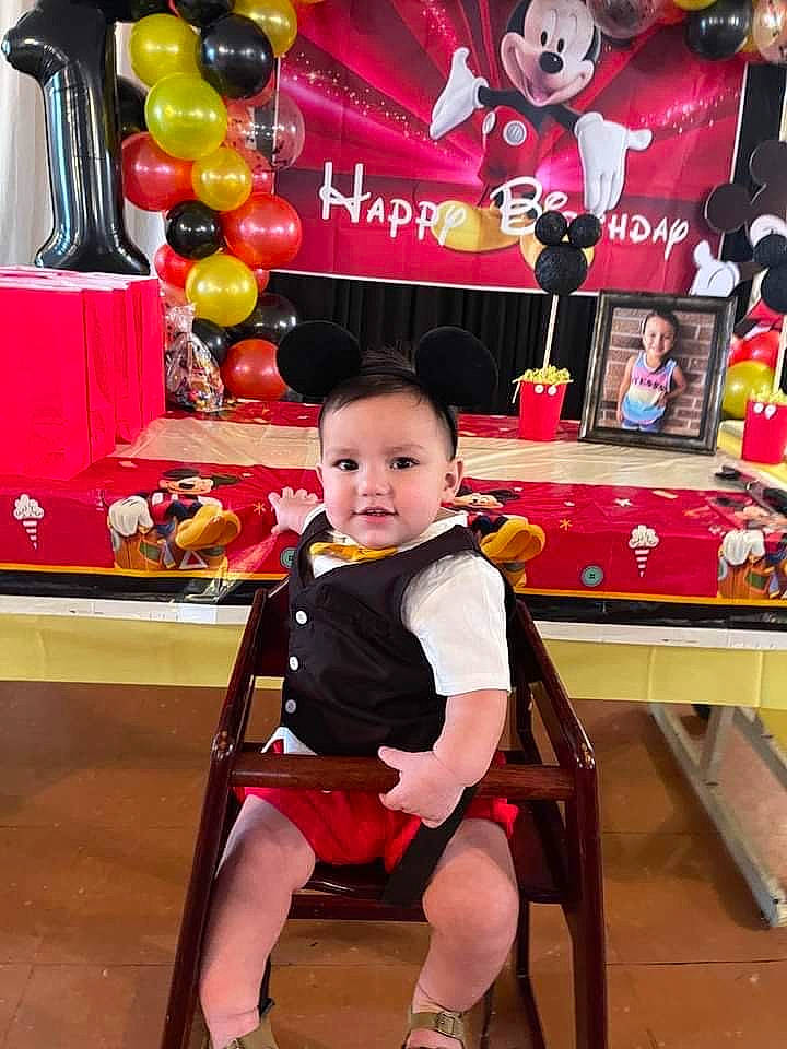 Dominic is registered to the contest to win money with this photo: baby, baby_toddler_clothing, balloon, beauty, chair, child, event, fun, happy, joy, leisure, magenta, person, pink, product, recreation, red, room, shorts, snapshot