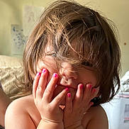 Millie is registered to the contest to win money with this photo: child, closeup, cute, expression, face, fingers, hair, hands, home, indoor, messy_hair, nail_polish, natural_light, person, pink_nail_polish, playful, portrait, skin, toddler, young_child