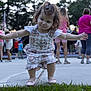 Millie joined the competition — help win amazing prizes! adult, blurred_background, casual_clothing, child, concrete, evening, grass, outdoor, park, people, pose, romper, shoes, shorts, sidewalk, summer, toddler, trees, walking, young_child