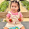 toddler, child, strawberries, basket, pigtails, pink_clothing, outdoor, bench, farm, field, plants, fruit, summer, nature, happy, cute, portrait, sitting, daylight, fresh