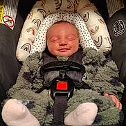 Kelce joined the competition — help win amazing prizes! baby, infant, car_seat, smile, sleeping, fuzzy_clothing, child, headrest, seatbelt, safety, cute, newborn, cozy, car_accessory, patterned, soft, indoor, portrait, peaceful, snugride