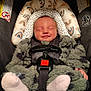 baby, infant, car_seat, smile, sleeping, fuzzy_clothing, child, headrest, seatbelt, safety, cute, newborn, cozy, car_accessory, patterned, soft, indoor, portrait, peaceful, snugride