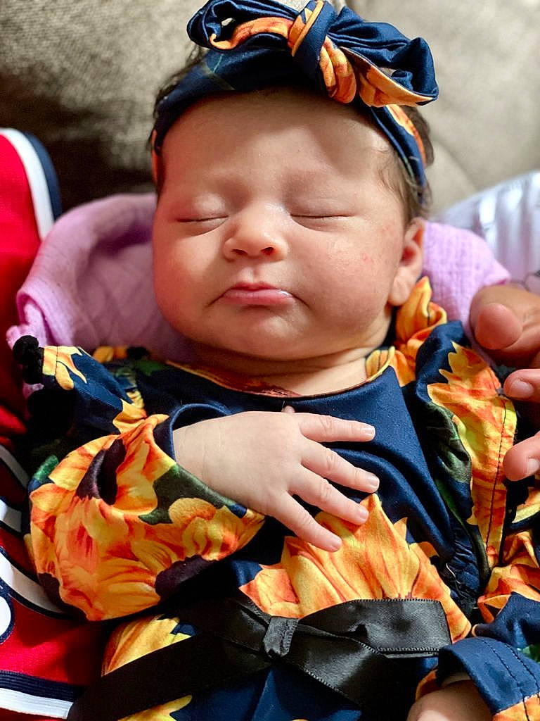 Crystal is registered to the contest to win money with this photo: baby, baby_carriage, baby_products, baby_toddler_clothing, blue, cap, cheek, child, event, fashion_accessory, fun, grass, happy, headgear, jewellery, orange, person, personal_protective_equipment, skin, toddler