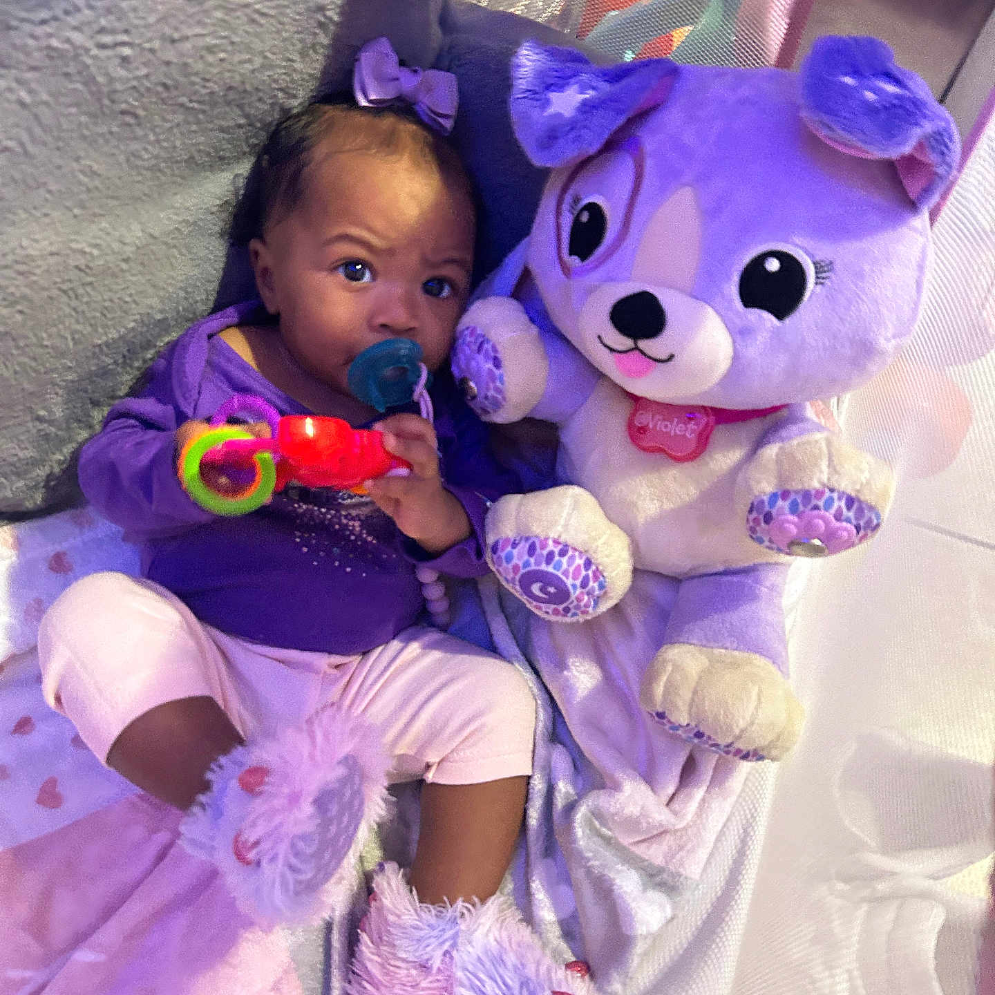 Xyairi joined the competition — help win amazing prizes! baby, blanket, child, clothing, cuddly, cute, face, fuzzy, indoor, infant, pacifier, person, pink, playpen, plush_toy, purple, sitting, slippers, soft_toys, toy