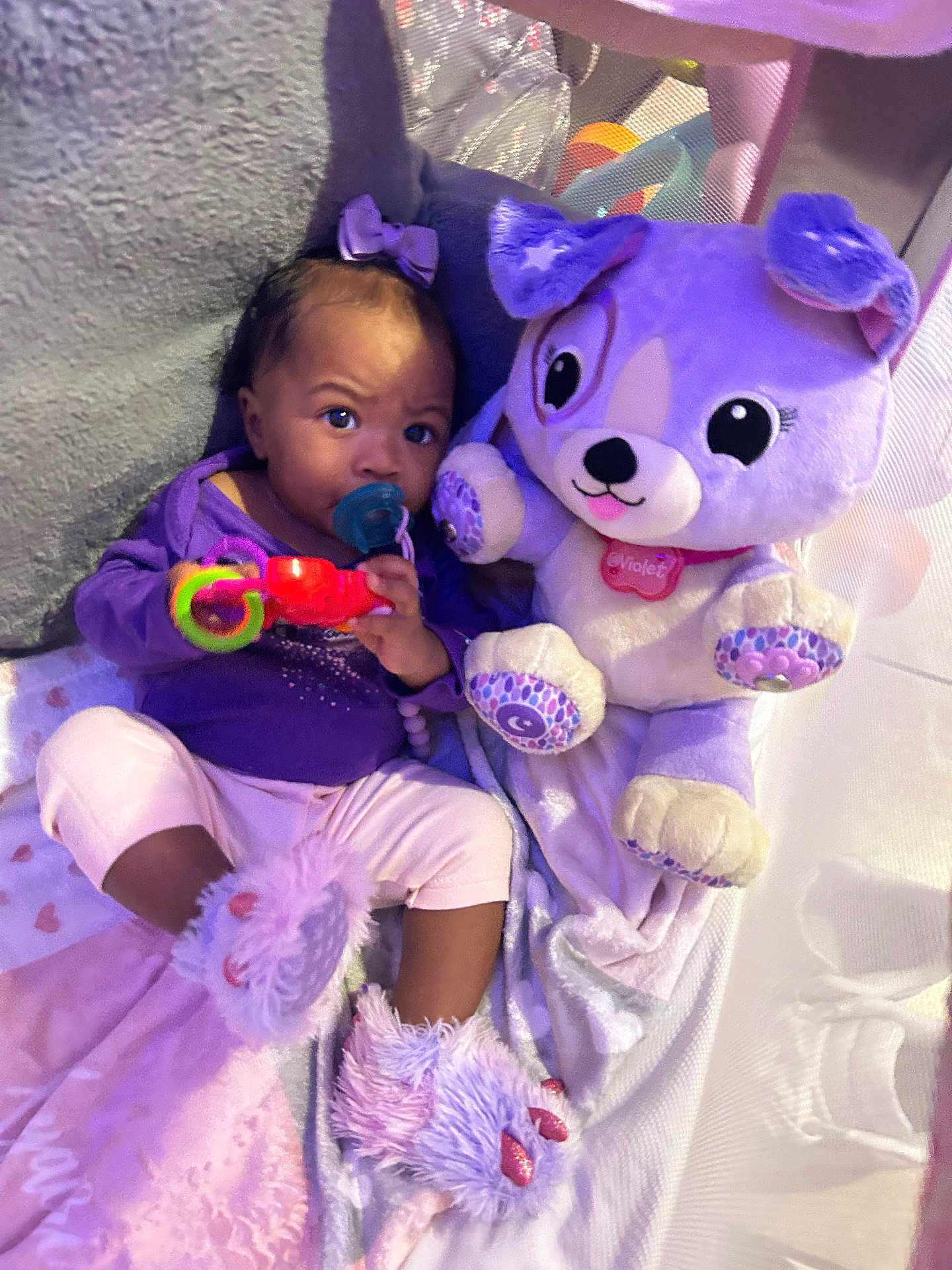 Xyairi joined the competition — help win amazing prizes! baby, child, pacifier, toy, plush_toy, purple, pink, blanket, slippers, fuzzy, indoor, cute, infant, person, soft_toys, playpen, clothing, sitting, face, cuddly