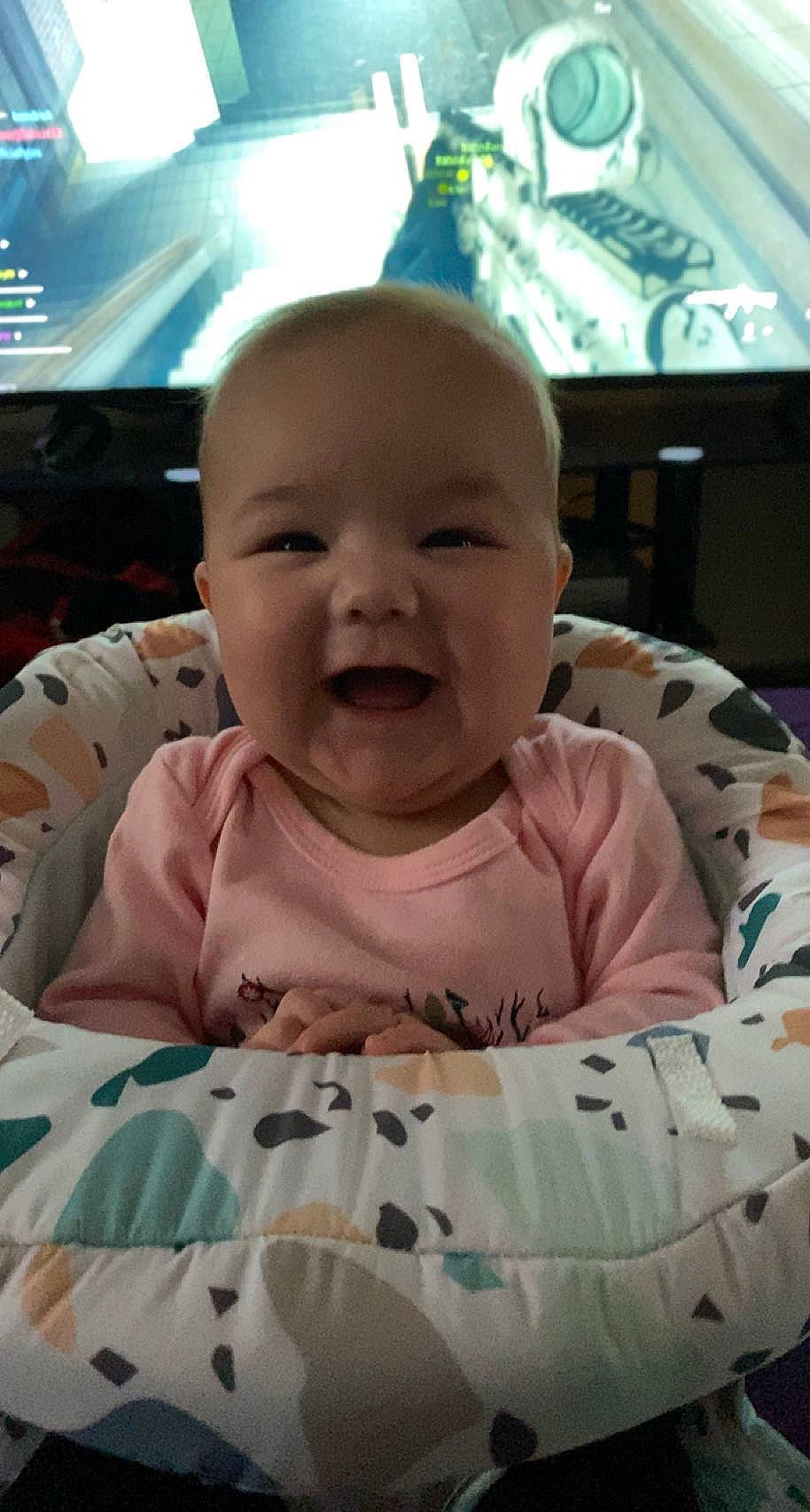 Elliana is registered to the contest to win money with this photo: baby, baby_products, baby_toddler_clothing, cheek, child, chin, comfort, facial_expression, fun, hairstyle, happy, iris, linens, mouth, nose, person, pink, skin, sleeve, smile