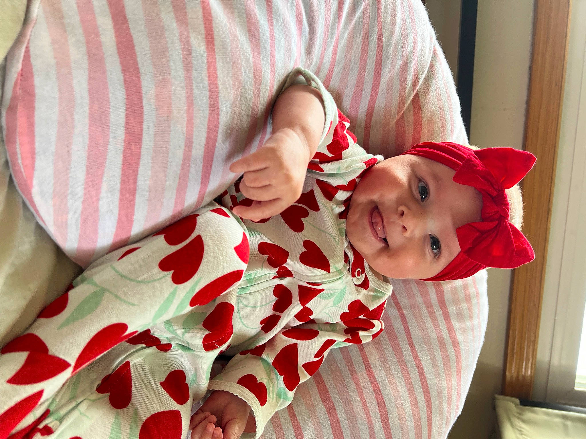 Aubrey joined the competition — help win amazing prizes! baby, baby_toddler_clothing, child, comfort, eye, finger, happy, hat, headwear, joy, linens, lip, pattern, person, pink, red, skin, sleeve, smile, sun_hat