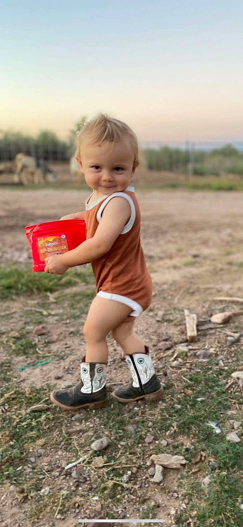 Kaiden joined the competition — help win amazing prizes! baby_toddler_clothing, child, fun, grass, grassland, happy, human_leg, joy, knee, leisure, people_in_nature, person, play, recreation, shorts, sitting, sky, smile, sneakers, soil