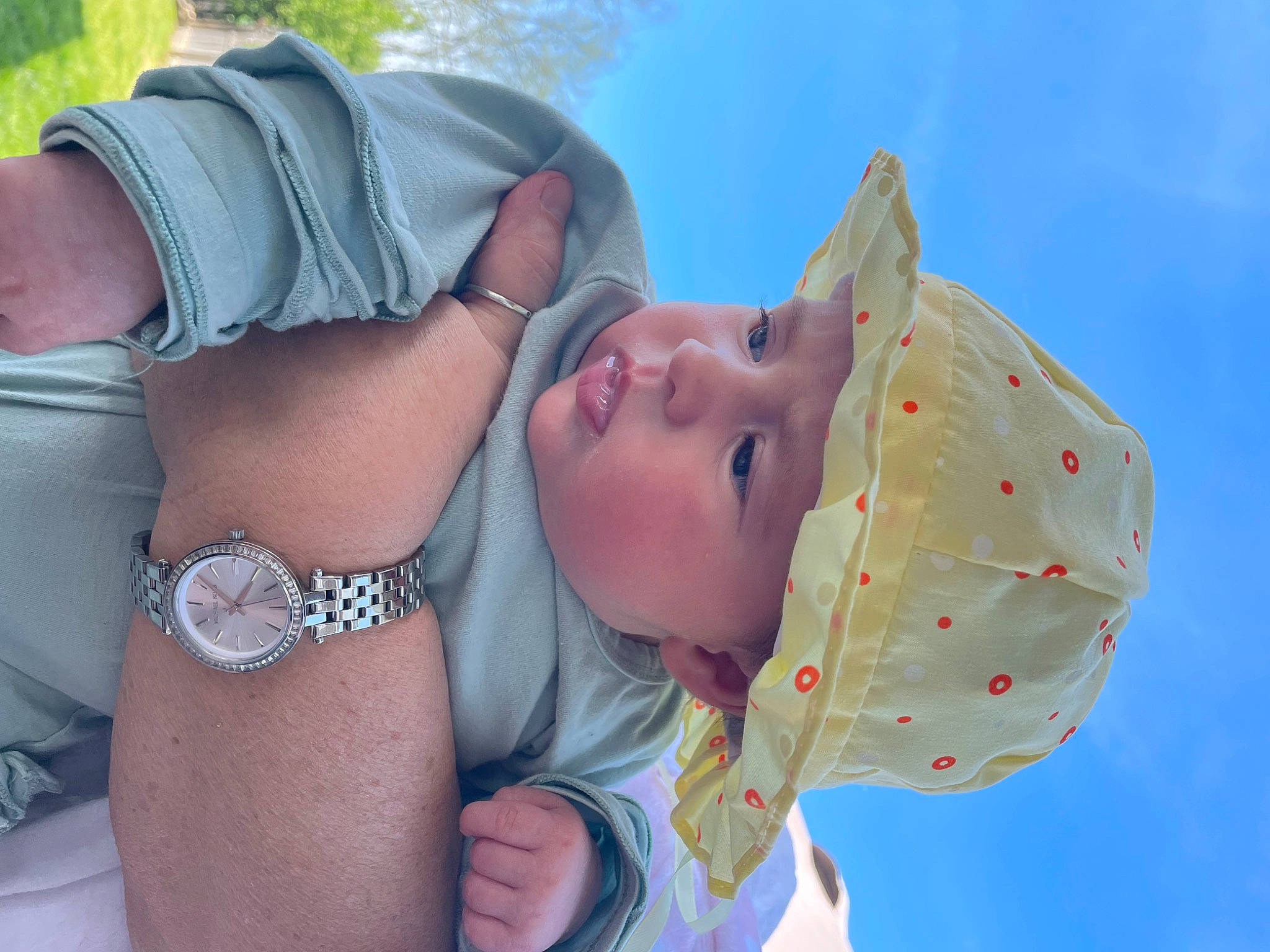 Eloise is registered to the contest to win money with this photo: child, elbow, eyewear, fashion_accessory, fun, gesture, grass, happy, headwear, human, human_body, human_leg, joint, leisure, muscle, pattern, people_in_nature, person, sky, thigh