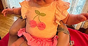 Sabrina joined the competition — help win amazing prizes! baby, baby_seat, cherry_design, child, clothing, curtains, cute, face, hat, indoor, infant, lace, looking, person, pink_clothing, pink_hat, portrait, sitting, wide_eyes, wooden_floor