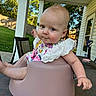 baby, child, infant, outdoor, patio, baby_seat, table, greenery, backyard, clothing, lace, face, expression, person, furniture, sunlight, blue_sky, trees, chair, toy