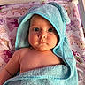 Sabrina joined the competition — help win amazing prizes! baby, child, towel, blue_towel, hooded_towel, blanket, pink_blanket, animal_print, princess_print, infant, cute, curious, indoors, portrait, face, expression, skin, chubby_cheeks, lying_down, soft_texture