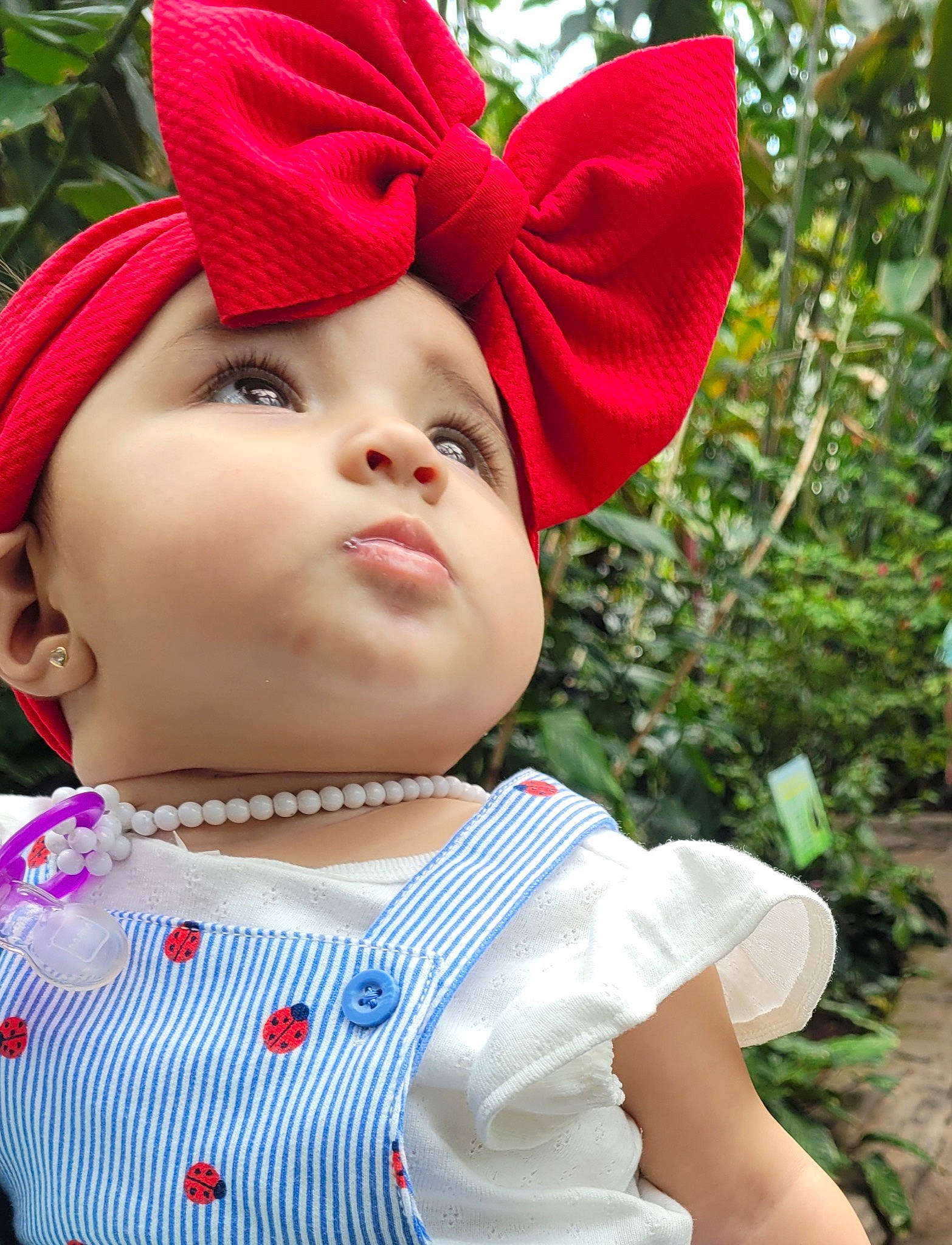 Avery is registered to the contest to win money with this photo: baby_toddler_clothing, cap, chin, costume_hat, eye, grass, happy, hat, head, headgear, headwear, lip, outerwear, person, pink, plant, skin, sleeve, smile, sun_hat