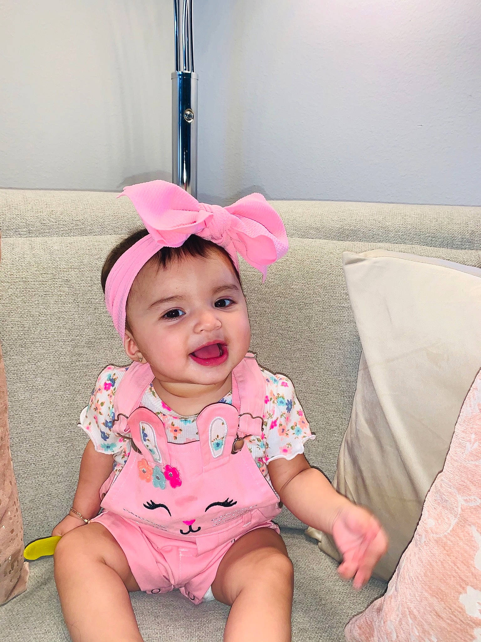 Avery joined the competition — help win amazing prizes! baby, baby_toddler_clothing, cap, child, comfort, face, facial_expression, fun, grass, happy, headgear, headwear, magenta, pattern, person, pink, sitting, skin, sleeve, smile