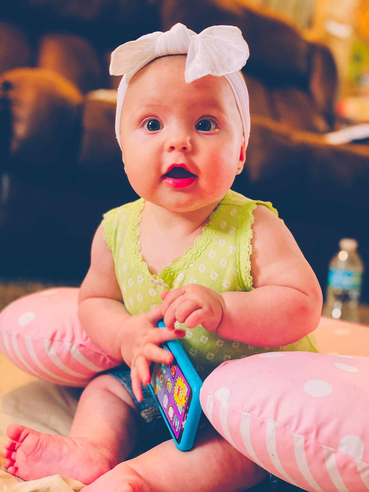 Everly joined the competition — help win amazing prizes! baby, baby_toddler_clothing, blue, cheek, child, dress, event, eye, finger, fun, hand, happy, hat, headwear, nail, person, pink, sitting, skin, surprise
